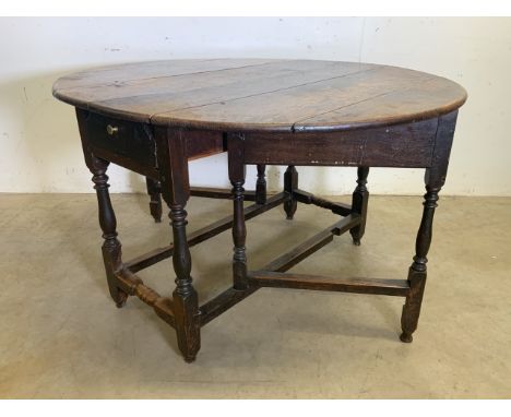 A late 18th early 19th century oak gate leg table.W:125cm x D:112cm x H:72cm