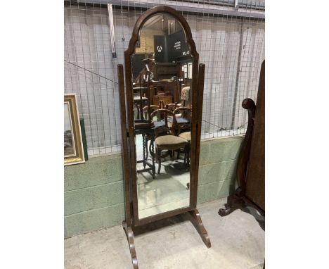An early 20th century mahogany cheval mirror with shaped bevelled glass. W:63cm x D:56cm x H:178cm