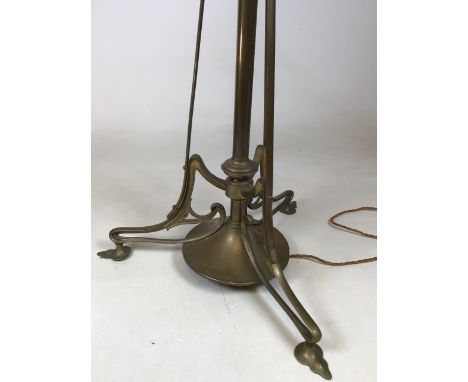 An art nouveau brass extendable standard lamp H:140cm