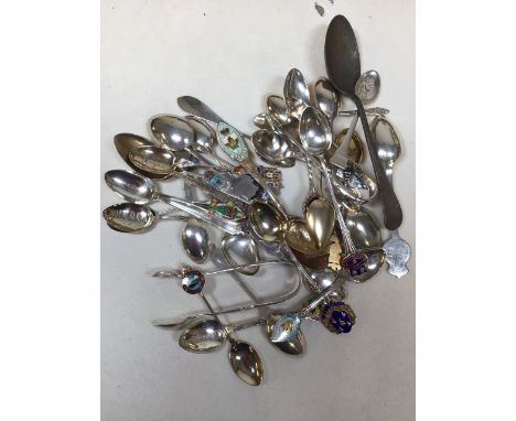 A collection of silver and silver plate spoons. Gross weight of silver spoons (including enamel) 226gm 
