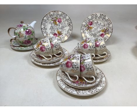 A vintage British Anchor Chintz tea set including six cups and saucers and five tea plate, together with a tea for one from t