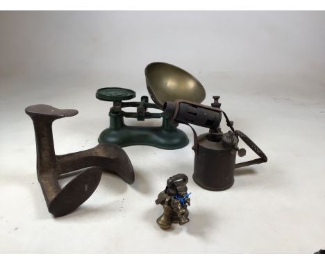 A pair of green metal scales labelled Boots of Nottingham with a set of brass weights together with a twentieth century paraf
