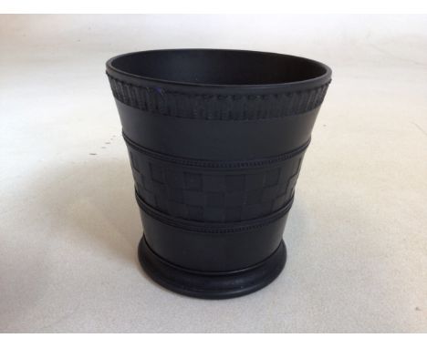 A Wedgwood black basalt vase with engine turned decoration signed 1933 Andrew Dykes. Height 10cm