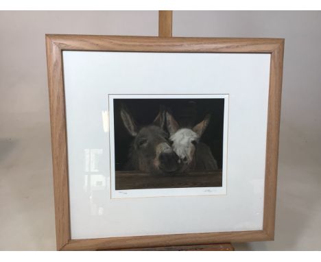 A limited edition print by Andrea Reynolds of donkeys. Marked 284 of 500 and signed in pencilW:50cm x H:46cm dimensions of fr