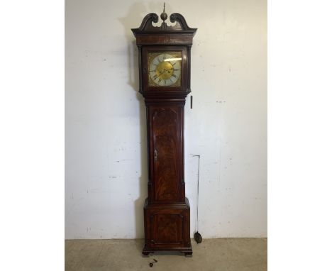 A 19th century flame mahogany grandfather clock by THOMAS HARGREAVES of Settler with brass and silvered dial.  With pendulum 
