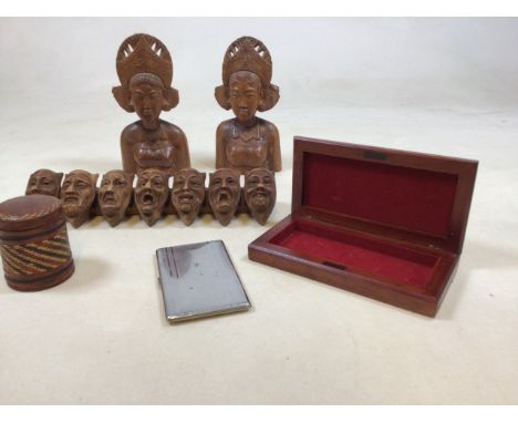 A carved pipe rack of seven deadly sins together with a pair of carved Eastern ladies, a leather covered tin, a wooden box an
