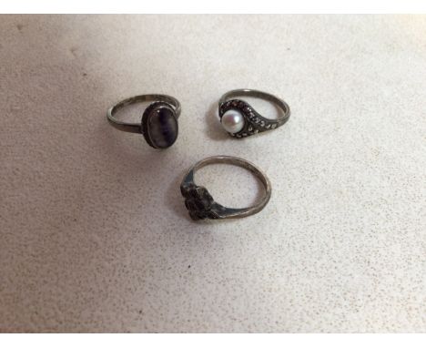 Three vintage silver rings including a marcasite ring 