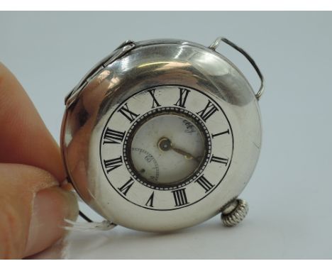 A 1920's silver top wound half hunter pocket watch converted to use with wrist strap, having Roman numeral dial with subsidia