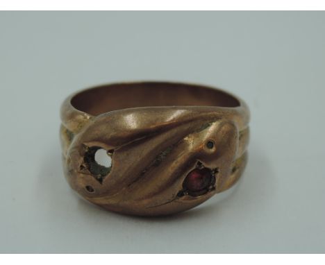 A 9ct rose gold entwined snake ring having ruby set eyes (one missing), size R &amp; approx 7.1g
Condition Report
mark on loo