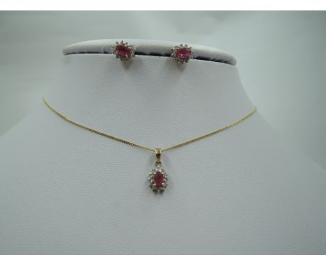 A ruby and diamond chip cluster 9ct gold pendant and matching earrings, approx 18' &amp; 2.4g