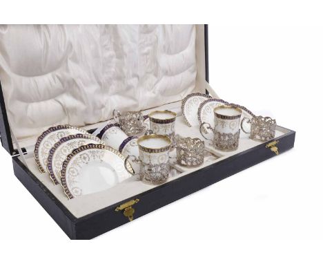 AYNSLEY COFFEE SERVICE WITH SILVER MOUNTSto include six coffee cans and saucers, each with cobalt blue banding with gilt high