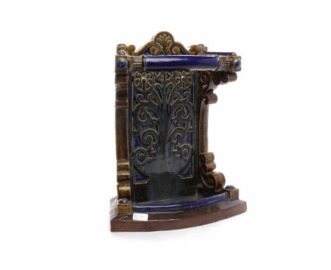 EARLY 20TH CENTURY DOULTON LAMBETH STONEWARE STICK STAND of oblong form, scroll ornamented back with incised flowerheads and 