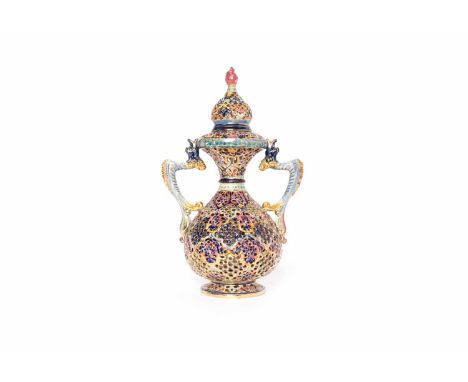 DOUBLE-HANDLED VASE AND COVER IN THE MANNER OF ZSOLNAY PECSof bulbous baluster form, the body reticulated and decorated in pr