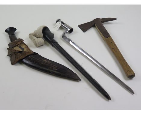 Miscellaneous: Old Military Pattern Kukri (scabbard worn), and a military (?) axe marked 10.2.40, plus a replica Brown Bess b