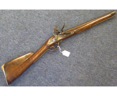 A Flintlock Musket converted from a Brown Bess to a short carbine. Barrel 16" with the two standard proofs. Standard lock (un