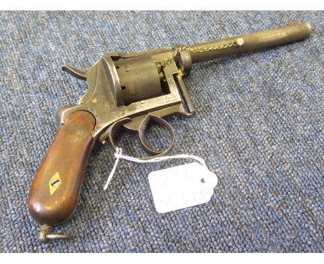 A 9mm Pinfire 7 shot revolver circa 1860. Frame marked 'A. FAGNUS' Brevette Double action. Barrel 5". Bag shaped rosewood ? g
