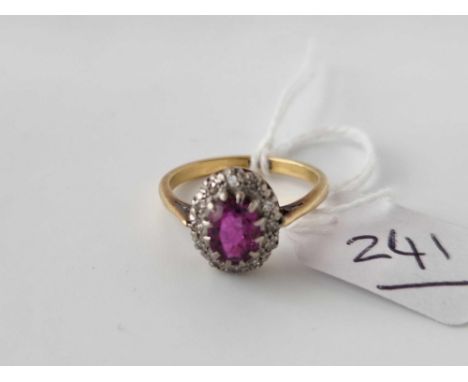 A pink sapphire and diamond cluster ring 18ct gold size N 3.4 gms