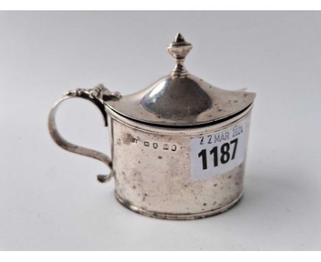 A good George III oval mustard pot with urn finial to cover, 4 inches over handle, London 1799 by SH, 132 g excluding bgl