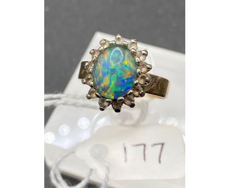 A opal and white stone ring on 9ct shank size R 3.6 gms