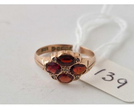 A garnet and diamond ring 9ct size N 1.3 gms