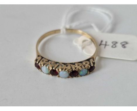 A opal and garnet half hoop ring 9ct size X 2.4 gms