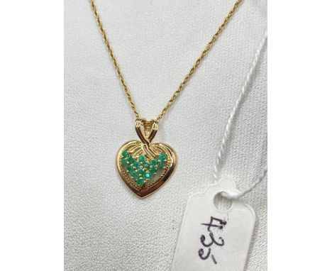 A good emerald heart pendant necklace with gold 18 inch chain