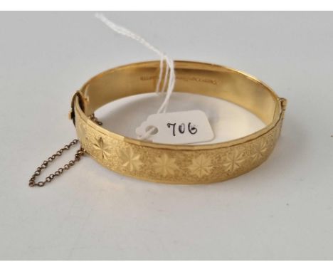 A heavy rolled gold bangle