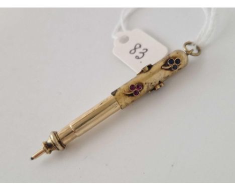 A attractive 19th century gold propelling pencil with ruby's emeralds and sapphires 7.3 gms