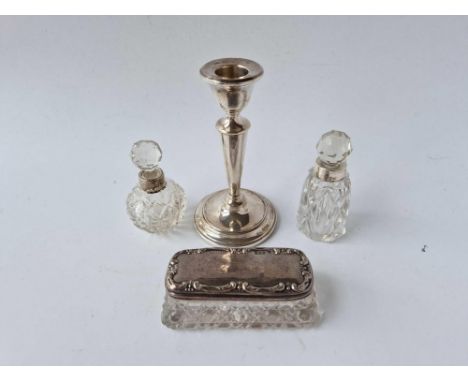 Two scent bottles, oblong jar and a candlestick