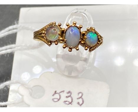 A early antique fancy detailed three stone opal ring with blue and green flashes size L 1.6 gms