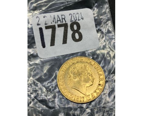 A gold George III sovereign good grade