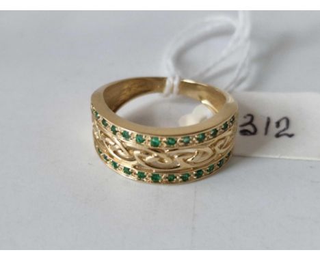 A fancy pierced emerald ring 14ct gold size P 3.8 gms