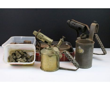 Vintage cast iron weights together with Sievert brass blow torch lantern and Monitor model blow torch 