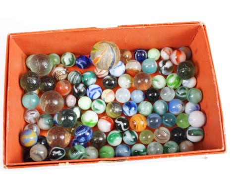 A collection of vintage marbles of various sizes and colours. 