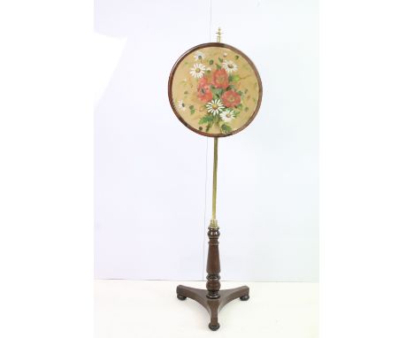 Victorian pole screen, the circular panel painted with poppies and daisies with adjustable brass support on tripod base, 133.