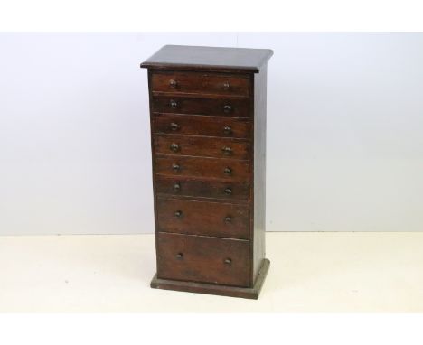 Early 20th century collector's specimen table top chest of eight graduated drawers with sewing paraphernalia and assorted vin