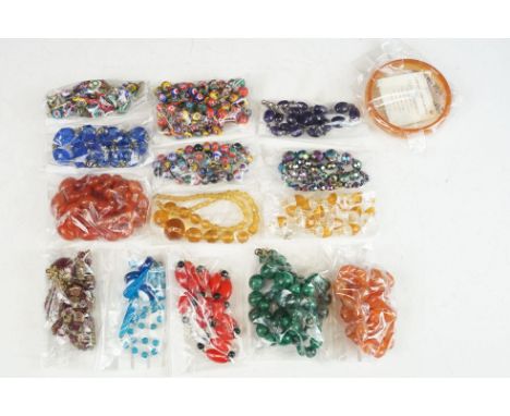 A collection of vintage costume jewellery beaded necklaces to include Corniola and Malachite examples. 