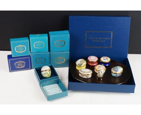 A collection of Halcyon Days enamel trinket boxes complete with display box and board. 