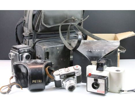 Selection of cameras and accessories to include Polaroid Swinger Model 20, Petri Flex TLR , Del Monta TLR, Super Paxette rang