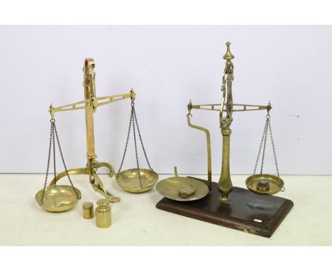 Antique set of brass weighing scales by Degrave &amp; Co, London with £10 and £1 weights, H 49cm and a set of double plate br