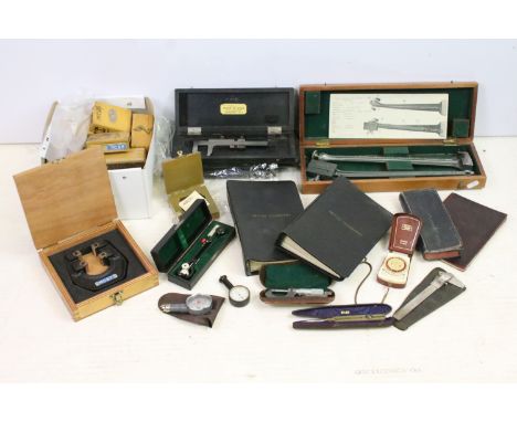 Collection of mid 20th century engineering tools, thread calipers, Hoppus's measurer's book etc 