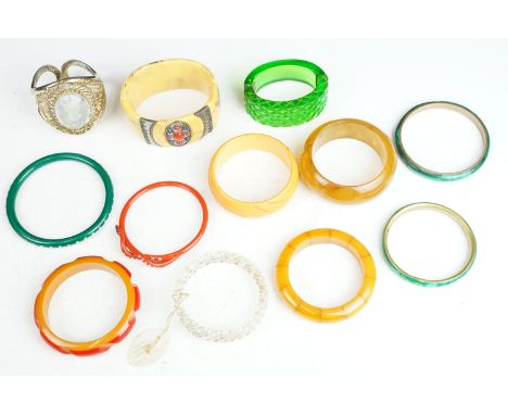 Collection of vintage early plastic bangle bracelets to include an Art Deco snake arm bangle, a spitfire hurricane bracelet (