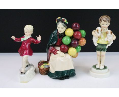 Royal Doulton seated figurine of 'The Old Balloon Seller' HN 1315 together with Royal Worcester child figurines 'January' 345