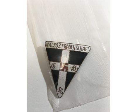 A Rare German Third Enamel badge of triangle shape awarded to Woman of the the National Socialist Party the reverse with rais