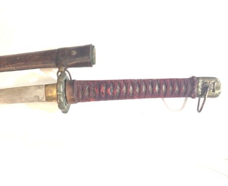 A Japanese Samurai sword possibly II world war Officers. the shagreen grip with red woven fabric with brass tsuba steel blade