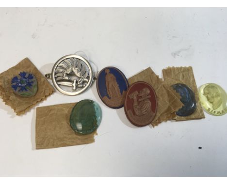 A Military badge possible French Foreign Legion. Glass intaglio and other badges.