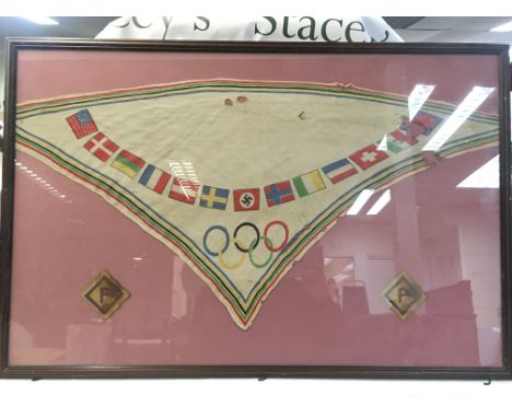 A framed girls HS scarfs from the 1936 Olympics. The two purple S badges are from Polish captives that were in concentration 