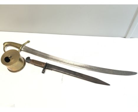 A 19th century short sword with brass hilt a bayonet possible Russian II world war and a trench art shell case container 1942