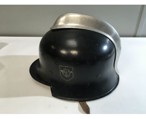 A German Third Reich firemans Steel helmet double decal side with applied aluminium comb leather lined.