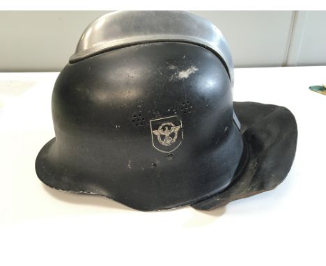 A German II world war Third Reich fireman helmet with double Decal sides raised aluminium comb leather neck cover liner and c